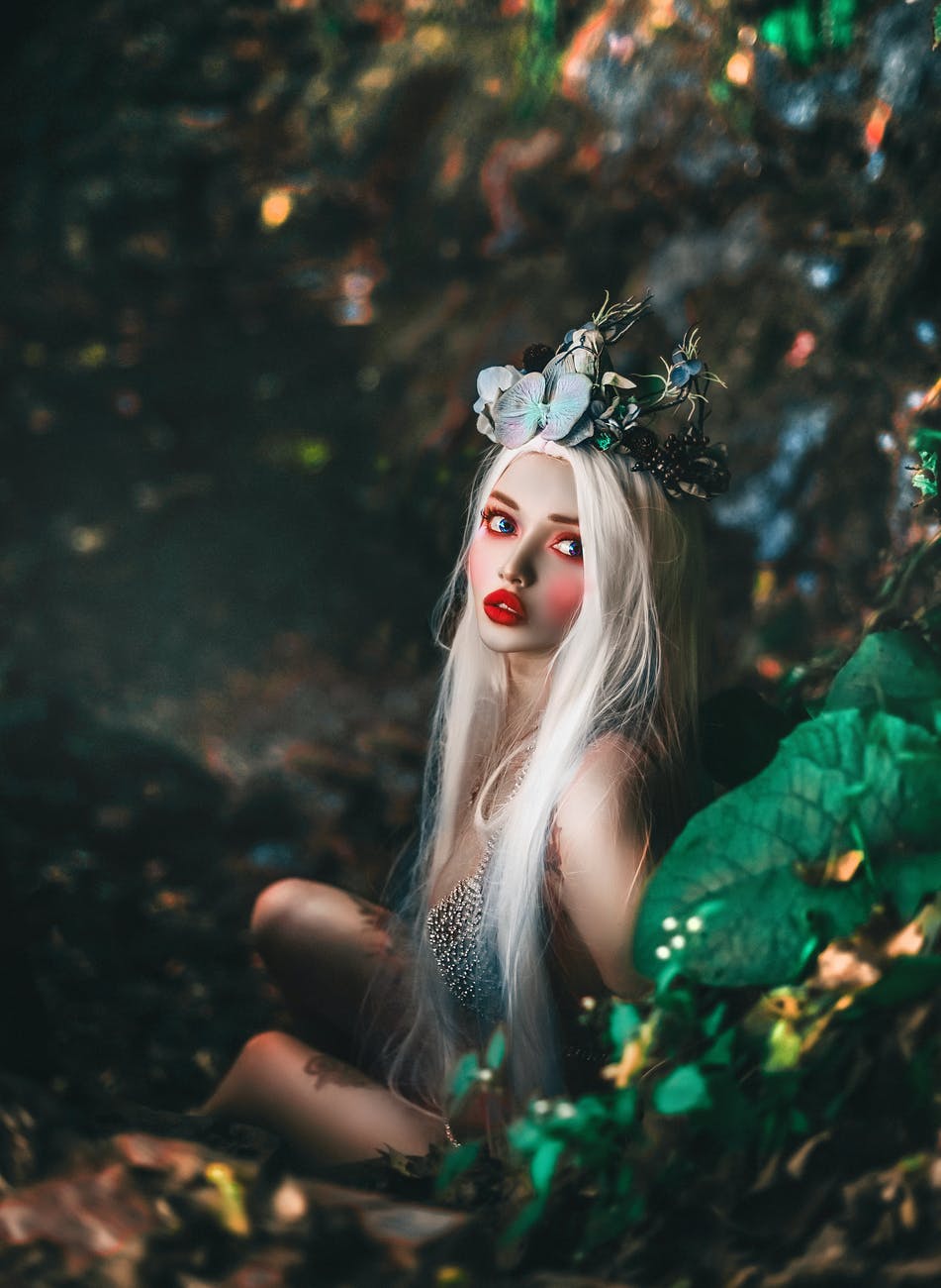 selective focus photography of woman wearing crown